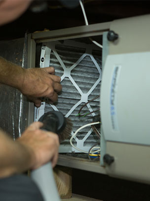 Air Duct Champ changing filter in attic